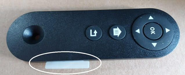 Cloud Connector remote control with plastic tab protruding from the right side